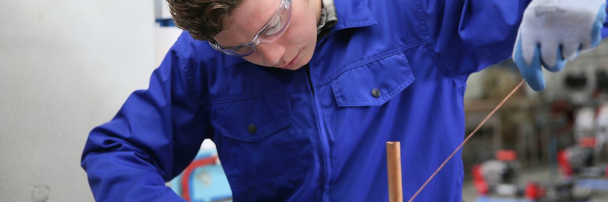 student in plumbing professional training, working on copper Schlagwort(e): metallurgy, welder, solderer, plumber, plumbing, copper, professional, craftsman, craftsmanship, young, man, apprentice, training, trainee, apprenticeship, overall, blue, protection, protective, glasses, melting, worker, working, workshop, heating, student, metallurgy, welder, solderer, plumber, plumbing, copper, professional, craftsman, craftsmanship, young, man, apprentice, training, trainee, apprenticeship, overall, blue, protection, protective, glasses, melting, worker, working, workshop, heating, student, ausbildung